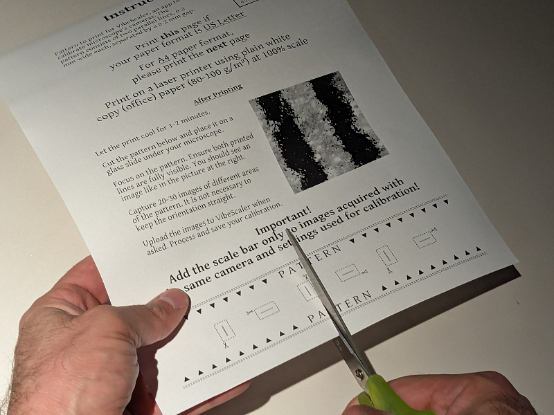 Photo of the pattern being cut from the bottom of the printed page.